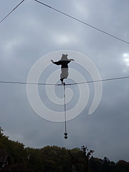 A statue of a tightrope bear above the Bear Pit, a tourist attraction in the Swiss capital city of Bern.