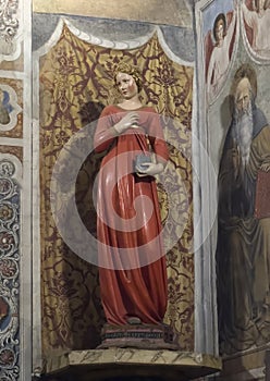 Statue titled 'Virgin Annunciate' by Jacopo della Quercia in the Colegiata di Santa Maria Assunta in San Gimignano.