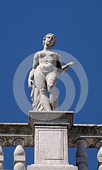 Statue at the top of National Library of St Mark`s Biblioteca Marciana, Venice