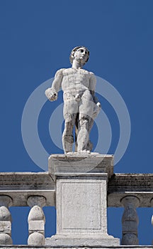 Statue at the top of National Library of St Mark`s Biblioteca Marciana, Venice photo