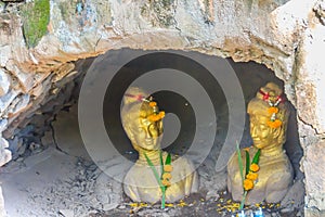 Statue of two ladies named Tapao Kaew and Tapao Thong in the Chalawan cave (Thai folktale), located at Wat Mahathat temple, Phichi