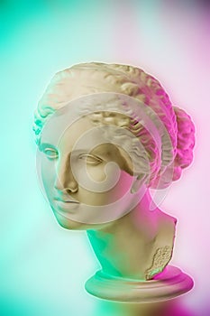 Statue of Venus de Milo. Creative concept colorful neon image with ancient greek sculpture Venus or Aphrodite head