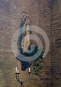 Statue of the Virgin Mary in the church of San Bartolo in San Gimgnano, Italy.