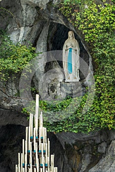 Statue of Virgin Mary in the grotto of Our Lady of Lourdes France photo