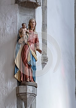 Statue of Virgin Mary and infant Jesus, Church of Saint Vitus, Cesky Krumlov, Czech Republic photo