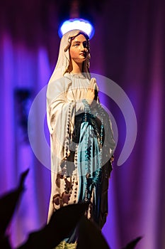 Statue of Virgin Mary with rosary