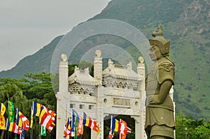 Statue on walkway with flags, Lantau Island, Hong Kong