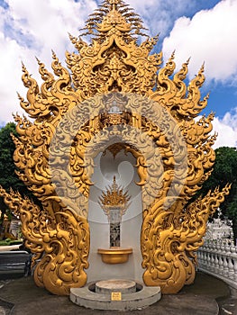 Statue of white Buddha Golden sculpture in Wat Rong Khun Chiang Rai