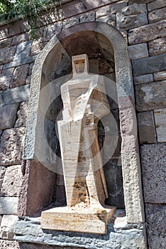 Statue of white stone in the courtyard of the Monastery of Santa Maria de Montserrat near Barcelona, Catalonia, Spain