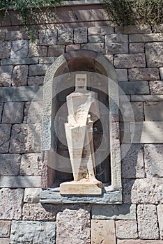 Statue of white stone in the courtyard of the Monastery of Santa Maria de Montserrat near Barcelona, Catalonia, Spain