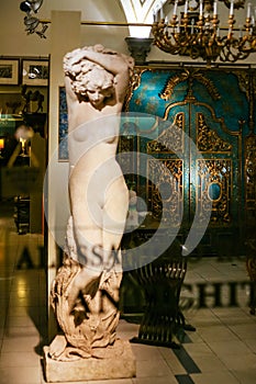 Statue in window of an antique store in Florence