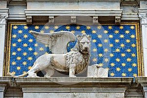 Statue of winged lion in St. Mark`s Square in Venice photo