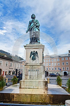 Statue of Wolfgang Amadeus Mozart on Mozartplatz or Mozart Square in old city of Salzburg. Austria