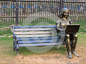 Statue of woman on bench in Eco Park in Kolkata