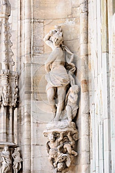 Statue of woman and cherubs,Milan Cathedral, Italy photo