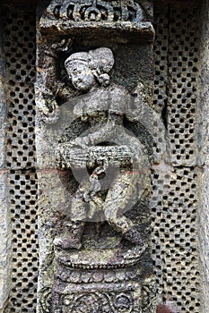 STATUE OF A WOMAN AT KONARK TEMPLE OF ORISSA-INDIA photo