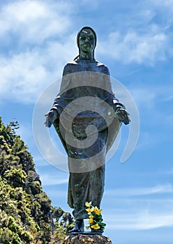 Statue of a woman outside the Church of San Giorgio, Portofino, Italy