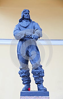 Statue of a young handsome man, a Russian military pilot in full flight uniform during the second world war.