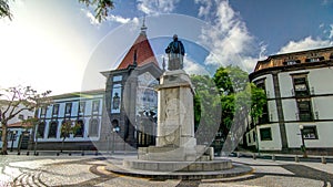 A statue of Zarco stands on the Avenida Arriaga timelapse hyperlapse in Funchal, Madeira, Portugal.