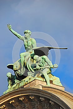 Statue Zeitgeist on top main front gate, remains of old facade building before burnt down of Lucerne railway station, Switzerland