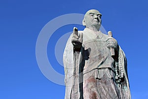 A statue of monk at a Japanese Shorinzan Honrenji temple in Nagasaki