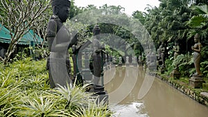 Statues alongside the lake