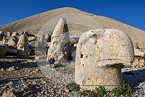 Statues of Apollo left, Zeus centre and and a Persian eagle god right on the weatern face at Mt Nemrut in Turkey.