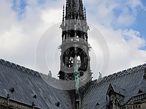 Statues of the apostles on the roof of Notre Dame, the approach of fragments. Paris France, UNESCO world heritage site