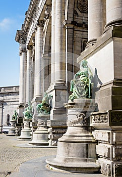 The statues at the base of the arcade du Cinquantenaire by a sunny day in Brussels, Belgium