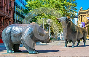 Statues of a bear and a bull in front of Stock Exchange building in Frankfurt, Germany photo