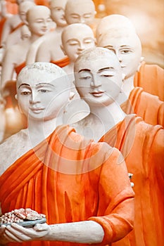 Statues of Buddhist monks in Dambulla Cave Temple outside. Sri Lanka