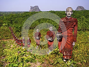 Statues of Buddhist Monks in the Forest, Mawlamyine, Myanmar