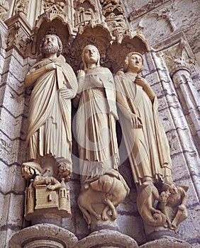 Statues details at Cathedrale Notre Dame de Chartres, a medieval old Catholic cathedral in Chartres, France photo