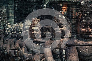 Statues in the entrance to the ancient city of Bayon in the Angkor Wat temple complex near Siem Reap, Cambodia