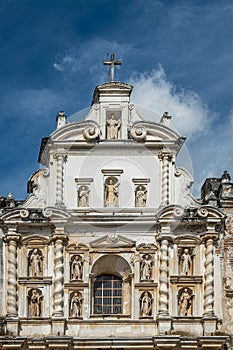 Statues in facade above entrance, San Francisco church portrait, La Antigua, Guatemala