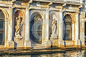 Statues on the facade of Giusti Palace on the Grand Canal of Venice, Italy