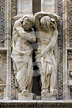 Statues in front of the dome of milan