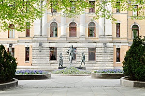 Statues in front of National Theater in Oslo photo