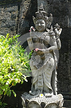 Statues of guardian gods temple in Bali. Brahma Vihara Arama with statues gods. balinese temple, old hindu architecture, Bali