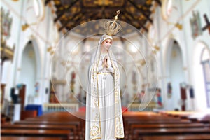 Statues of Holy Women in blur Roman Catholic Church background