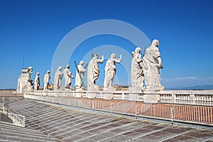 Statues of Jesus Christ, John the Baptist and 11 apostles on the roof of St. Peter`s Cathedral