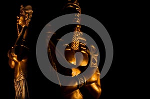 Statues of king egyptian pharaoh gods dead religion symbol isolated on black background photo