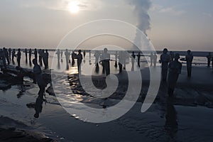 Statues in Lapindo mud.