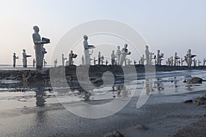 Statues in Lapindo mud.