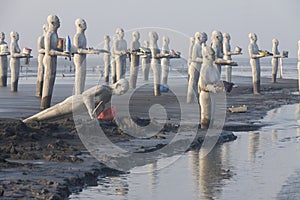 Statues in Lapindo mud.