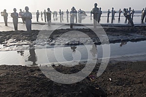 Statues in Lapindo mud.