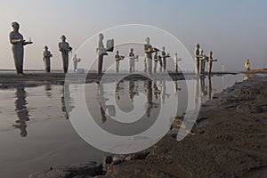 Statues in Lapindo mud.