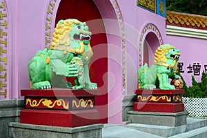 Statues of lions at the entrance to Yim Hing temple, Lantau Island, Hong Kong photo