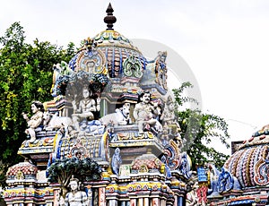 Statues of Lord Shiva and other mythological creatures on one of the Gopuram ancient Shiva temple in Pondicherry