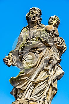 Statues of Madonna by Matej Vaclav Jackel on the north side of Charles Bridge over river Vltava in Prague, Czech Republic
